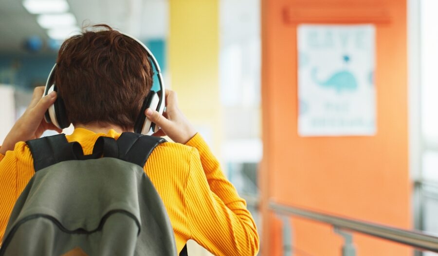 Kid with headphones preventing distractions